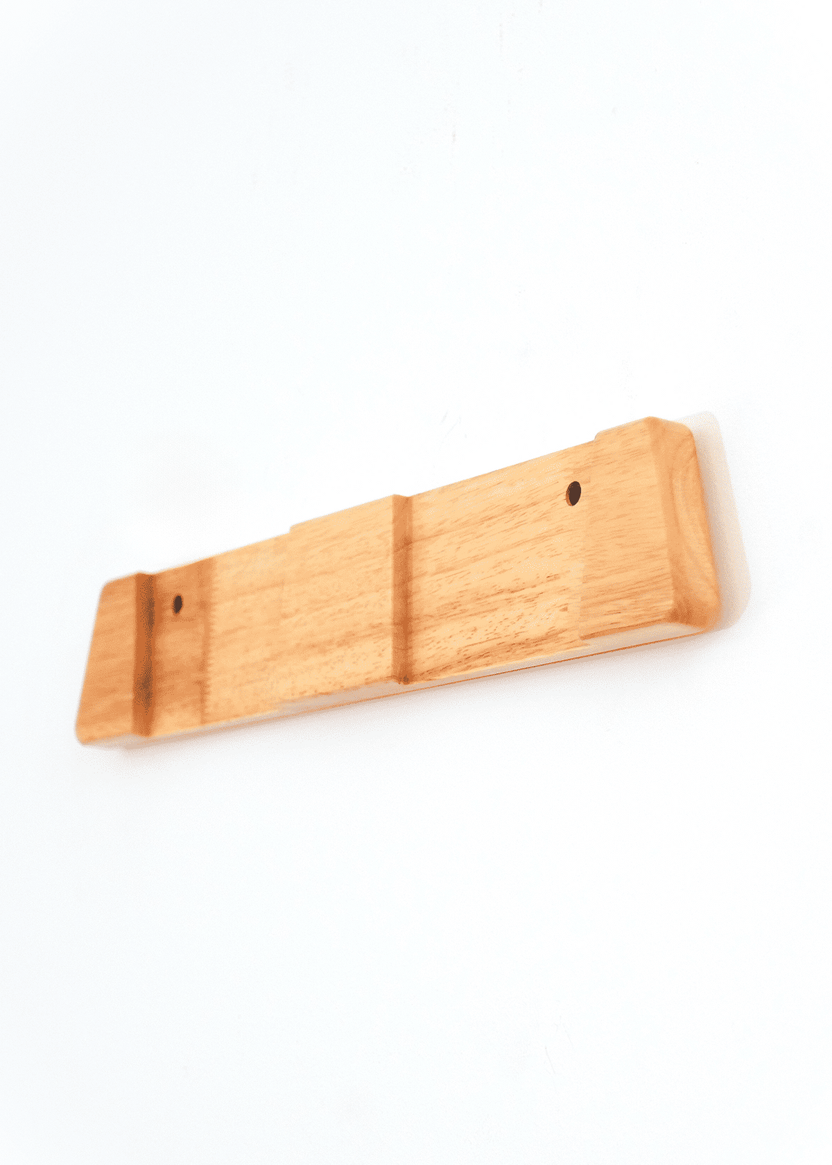 A small rectangular wooden wall ski rack, shown against a plain white background.