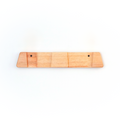 A light natural wood ski rack or board with two small pre-drilled holes, shown against a plain white background.